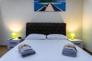 Postel nebo postele na pokoji v ubytování B&B Suite Penelope