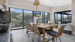 a kitchen and dining room with a table and chairs at VILLA LUCA in Katokhórion
