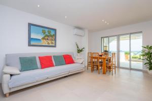 a living room with a couch and a table at Albers in Playa de Muro
