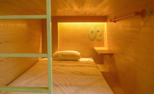 Postel nebo postele na pokoji v ubytování Leaf Sustainable Hostel