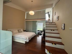 Letto o letti in una camera di 礁溪好好沐包棟溫泉Villa 龜山島景觀 客餐廳可開伙 KTV Netflix 禁菸 戶外平面停車
