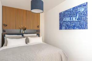 Postel nebo postele na pokoji v ubytování Studio Loreley am Rhein, moderne & vollausgestatte 40qm, Küche, Netflix, WM