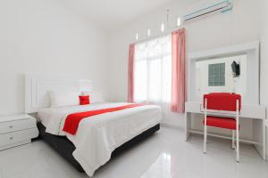 Ένα ή περισσότερα κρεβάτια σε δωμάτιο στο RedDoorz near Lampung City Mall