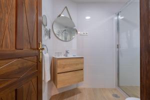 a bathroom with a sink and a shower at El Nogal Home in Málaga