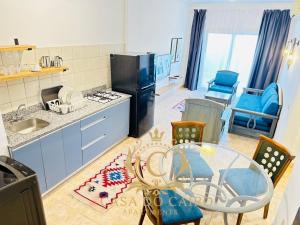 a kitchen with a table and chairs and a dining room at Casa Do Cairo-Sharm Alsheikh in Sharm El Sheikh