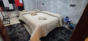 two large beds in a room with at Sweet Home Montecristo Civico 2 in Vibo Valentia