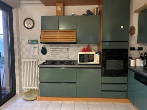 Kuchyň nebo kuchyňský kout v ubytování Accogliente Stanza Privata con Bagno Privato - Daniele's House