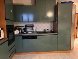 Kuchyň nebo kuchyňský kout v ubytování Accogliente Stanza Privata con Bagno Privato - Daniele's House