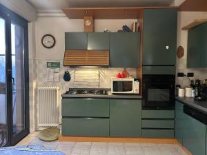 Kuchyň nebo kuchyňský kout v ubytování Accogliente Stanza Privata con Bagno Privato - Daniele's House