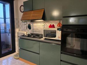 Kuchyň nebo kuchyňský kout v ubytování Accogliente Stanza Privata con Bagno Privato - Daniele's House