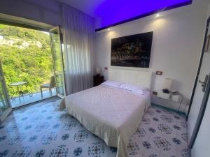 Postel nebo postele na pokoji v ubytování Hotel Vietri Coast