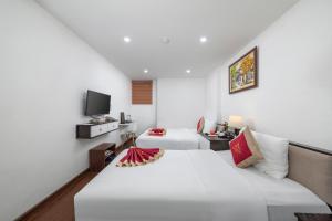 TV a/nebo společenská místnost v ubytování Hanoi Aria Central Hotel & Spa