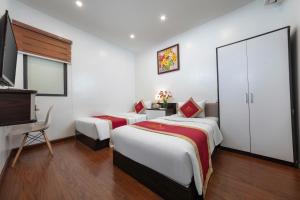 Postel nebo postele na pokoji v ubytování Hanoi Aria Central Hotel & Spa
