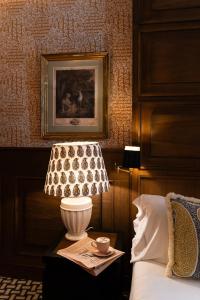 A bed or beds in a room at Room Mate Collection Alba, Madrid