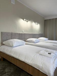 Posteľ alebo postele v izbe v ubytovaní Hotel TM