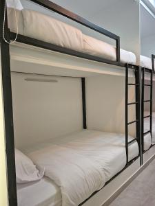 Postel nebo postele na pokoji v ubytování Hostal The Nest By Ulivin + 14 fotografií
