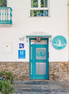 a blue door on the side of a building at El Nogal Home in Málaga