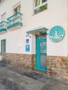 a blue door on the side of a building at El Nogal Home in Málaga