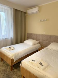 Posteľ alebo postele v izbe v ubytovaní Hotel TM