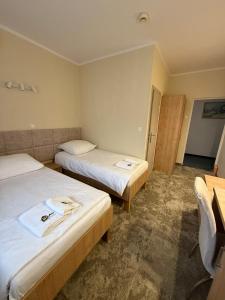 Posteľ alebo postele v izbe v ubytovaní Hotel TM