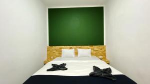 Voodi või voodid majutusasutuse D'Hills Hotel toas
