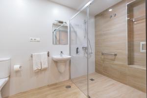 a bathroom with a shower and a sink at El Nogal Home in Málaga