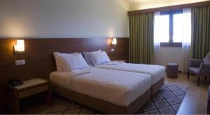 Cama ou camas em um quarto em Hotel Santo Andre