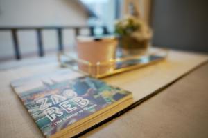 a book sitting on top of a table at ELLY Arena Zagreb Apartment in Zagreb