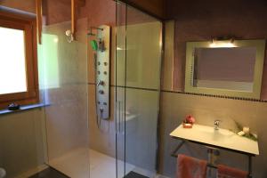 a bathroom with a shower and a sink at Village Paradis in Roisan +66 photos