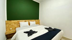 Voodi või voodid majutusasutuse D'Hills Hotel toas