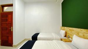 Voodi või voodid majutusasutuse D'Hills Hotel toas