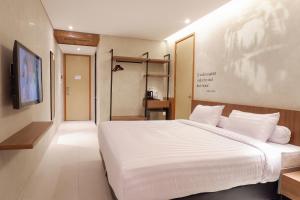 Letto o letti in una camera di Front One Resort Magelang