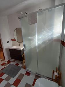 a bathroom with a shower and a toilet and a sink at La Casa degli Aceri Secolari - Affitti Brevi Italia in Coppito