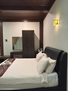 Postel nebo postele na pokoji v ubytování Singgahsana Villa Langkawi + 16 fotografií