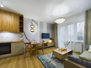 a living room with a couch and a table at ApartamentuSnu, Sportowa I in Radom
