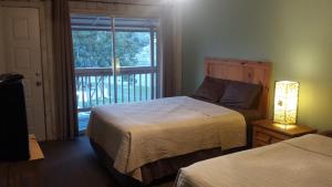 Tempat tidur dalam kamar di Lodge At Turkey Cove