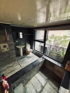 En eller flere senge i et værelse på Qing Tang Hot Spring B&B