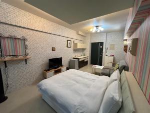 En eller flere senge i et værelse på Qing Tang Hot Spring B&B