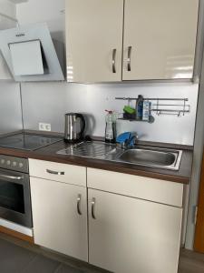 Kuchyň nebo kuchyňský kout v ubytování Ferienwohnung Kassel Zentral
