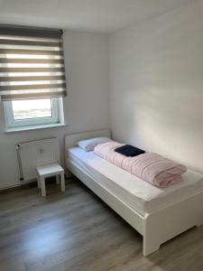 Postel nebo postele na pokoji v ubytování Ferienwohnung Kassel Zentral