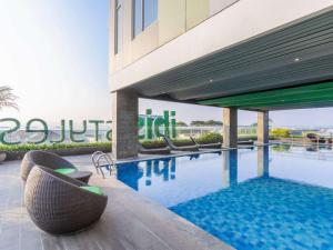 The swimming pool at or close to Ibis Styles Malang