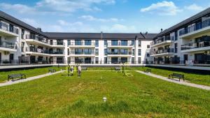 O grădină în afara JANTAR RESORT Apartamenty PIAMOLA