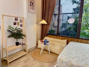 Postel nebo postele na pokoji v ubytování Corgi House Beachstay Danang