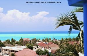 a view of the ocean from a resort at Daeli Apartment in Kendwa
