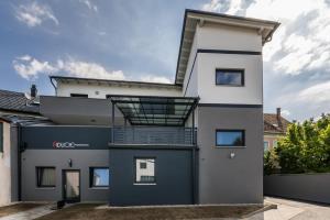 a house with a balcony on the side of it at life-stegersbach Suites in Stegersbach