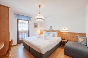 Postel nebo postele na pokoji v ubytování Albergo Vezzana