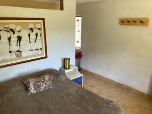 En eller flere senge i et værelse på Cabaña Rodar