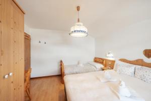 Postel nebo postele na pokoji v ubytování Albergo Vezzana