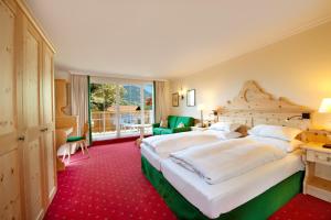 Кровать или кровати в номере Landhotel Römerhof
