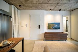 Et tv og/eller underholdning på Studio a 500m da Praia by Achei Camboriú